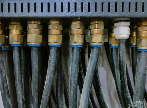 Row of coax cables connected to a distribution panel